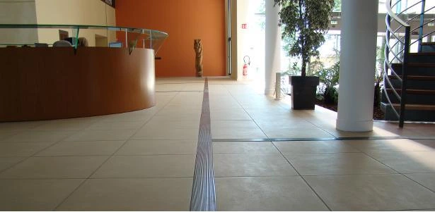 Example of making a public building accessible through tactile markings; they guide the blind and visually impaired person to the reception and to certain offices